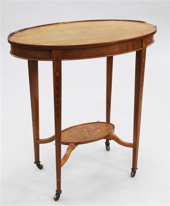 An Edwardian oval mahogany two tier occasional table, W.2ft 3in.